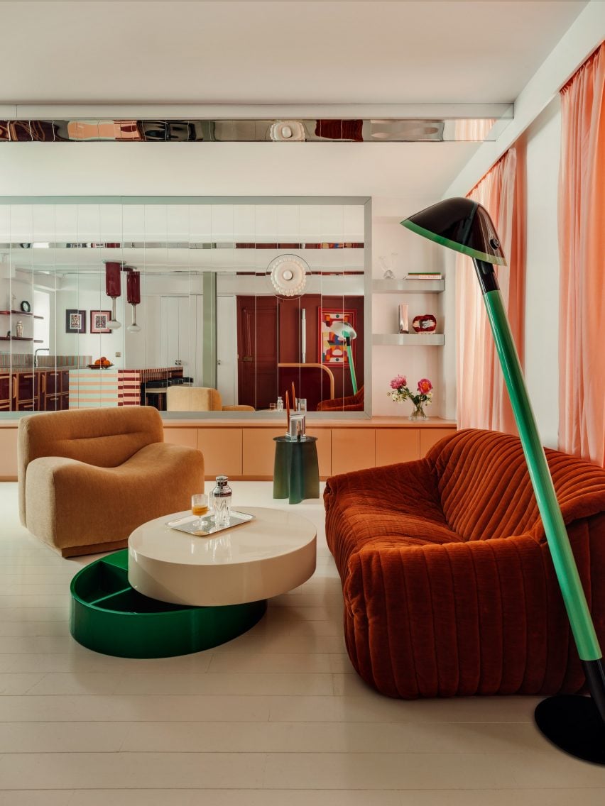 Living space with striped kitchen island and low-slung seating