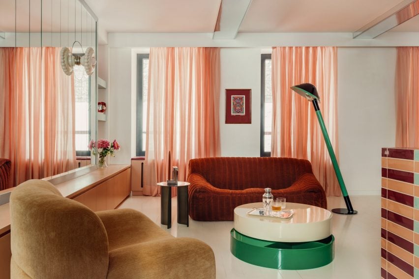 Living space with striped kitchen island and low-slung seating