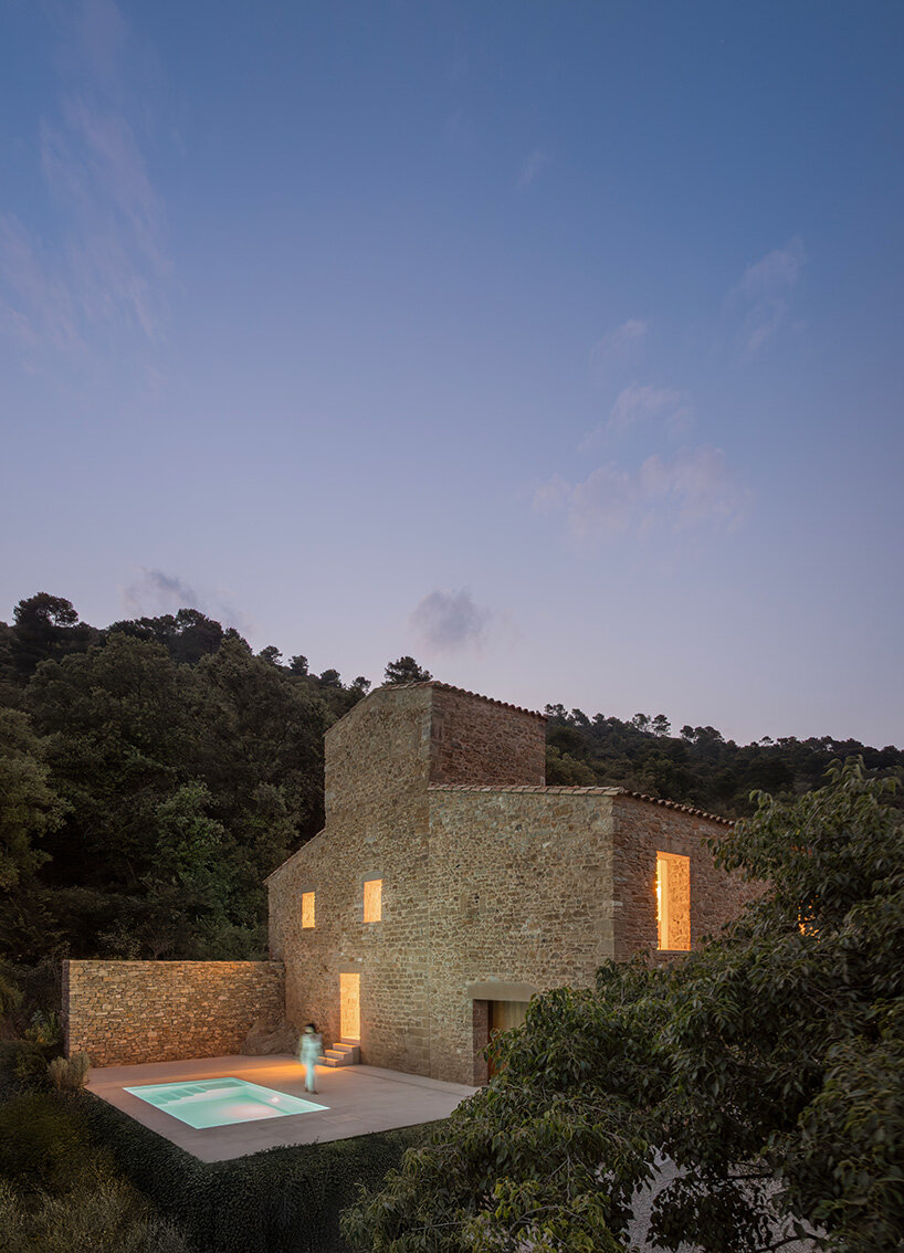 fran silvestre restores limestone farmhouse in spain as off-grid home and workspace